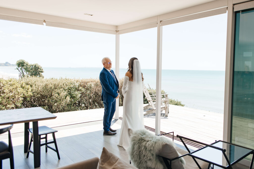 Bride shares emotional first look with father before Old Forest School wedding ceremony.