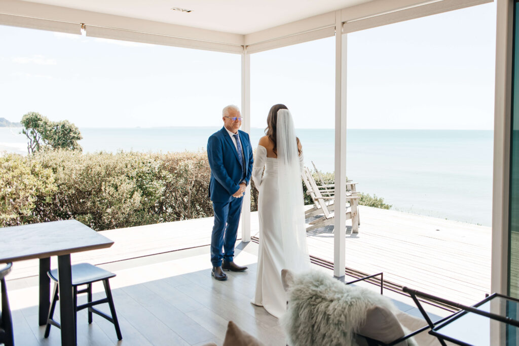 Bride shares emotional first look with father before Old Forest School wedding ceremony.