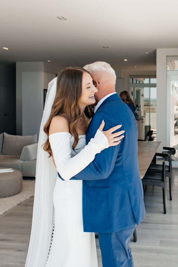 Bride shares emotional first look with father before Old Forest School wedding ceremony.